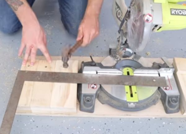 drive the nails to fix the miter saw board